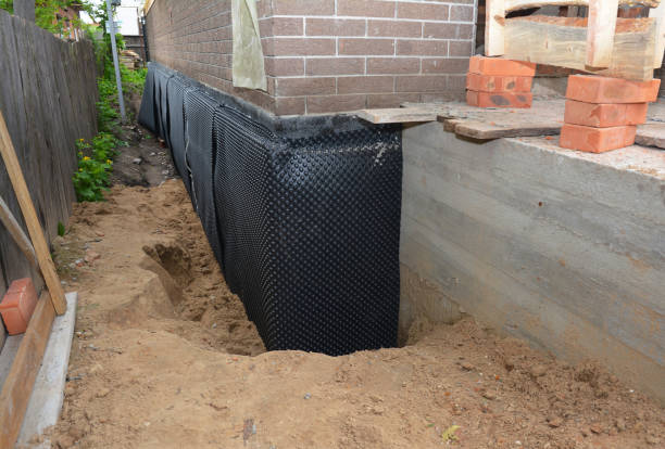 Happy homeowners after waterproofing job in Elma